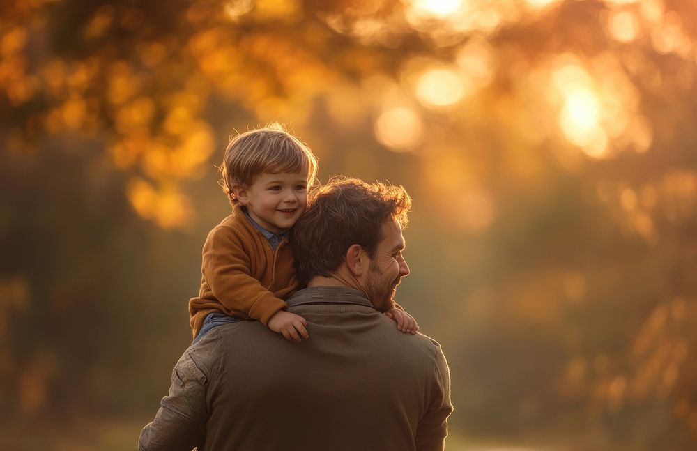 Father carrying a cute little boy background people person.