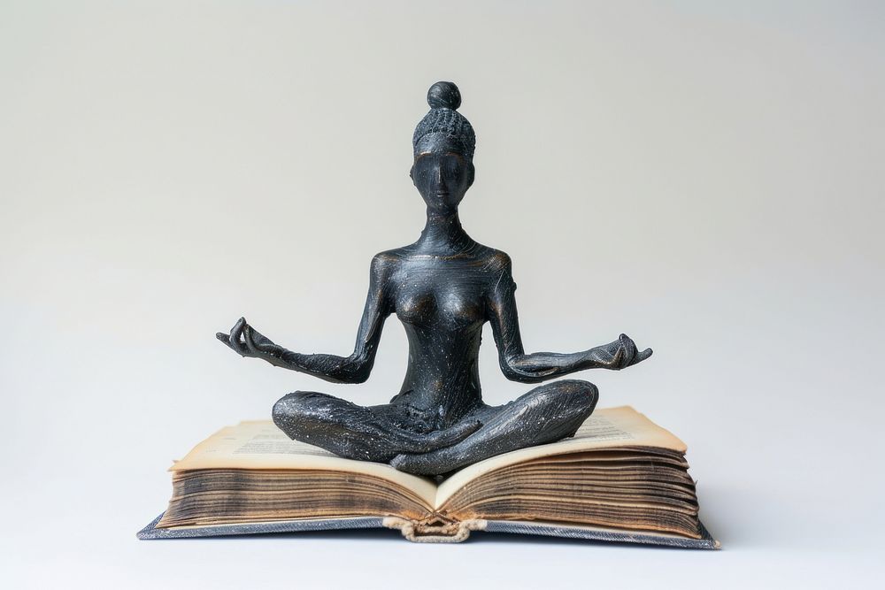 Mindfulness coach book meditation sculpture.