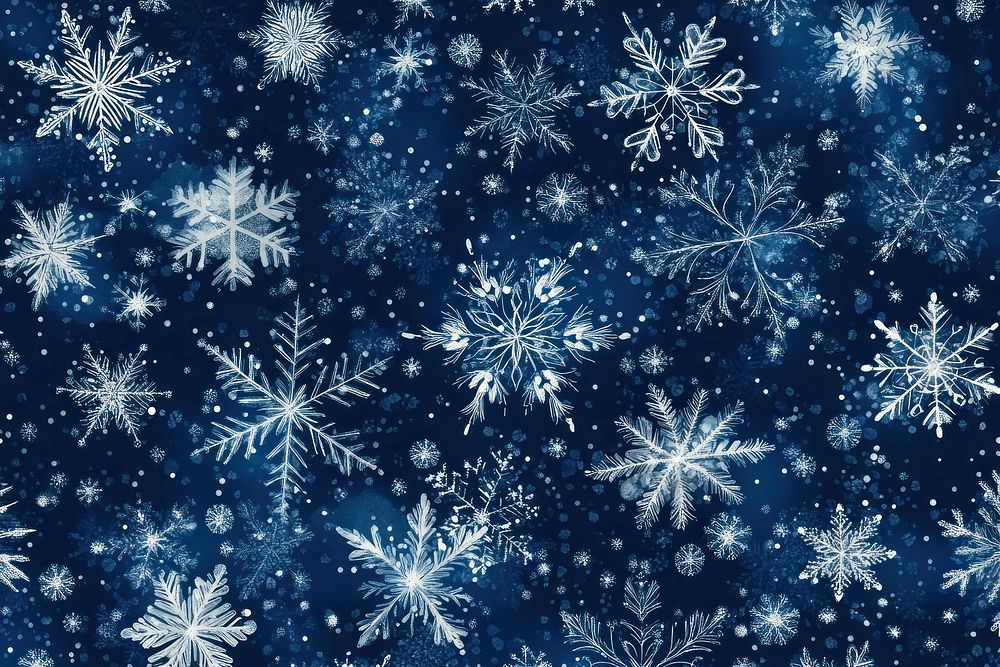 Intricate snowflakes on dark background.