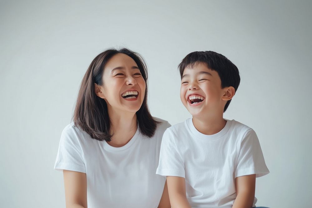 Mom and his young son happy background laughing.