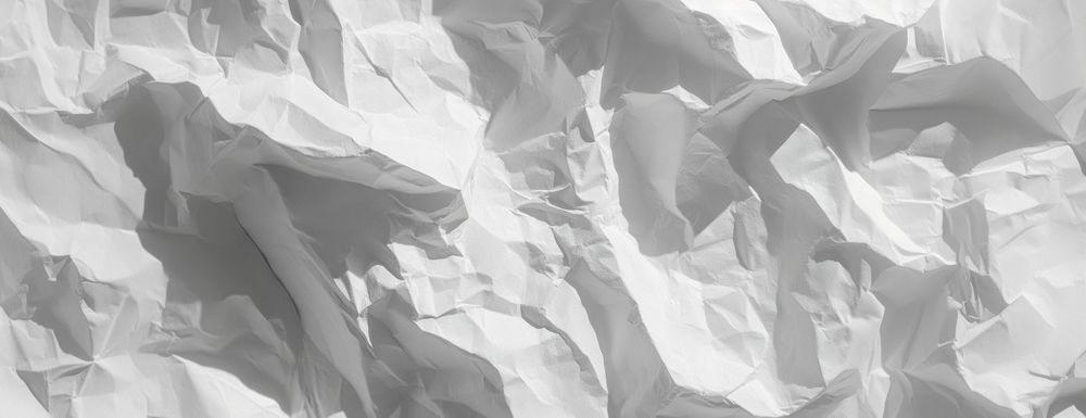 Texture of crumpled white paper background surface design.