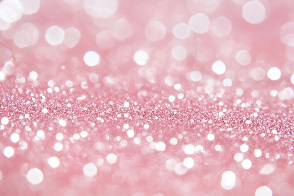 Pale pink glitter background texture sparkling backdrop blurred.