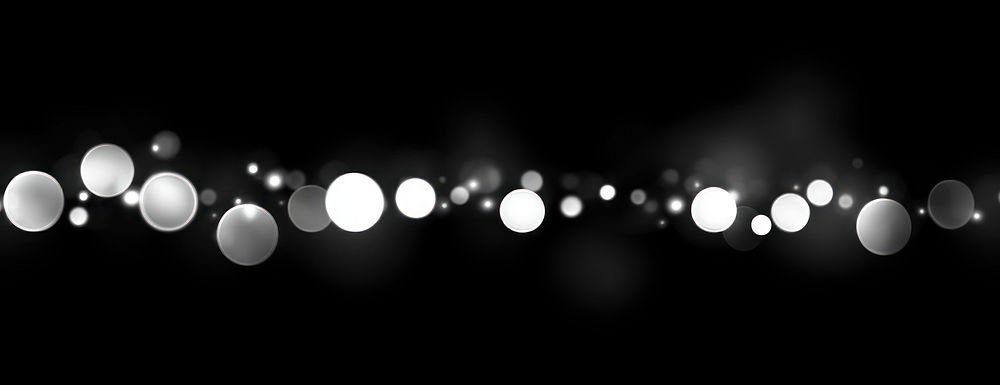 Abstract white bokeh lights on a grey background abstract blurred astronomy.