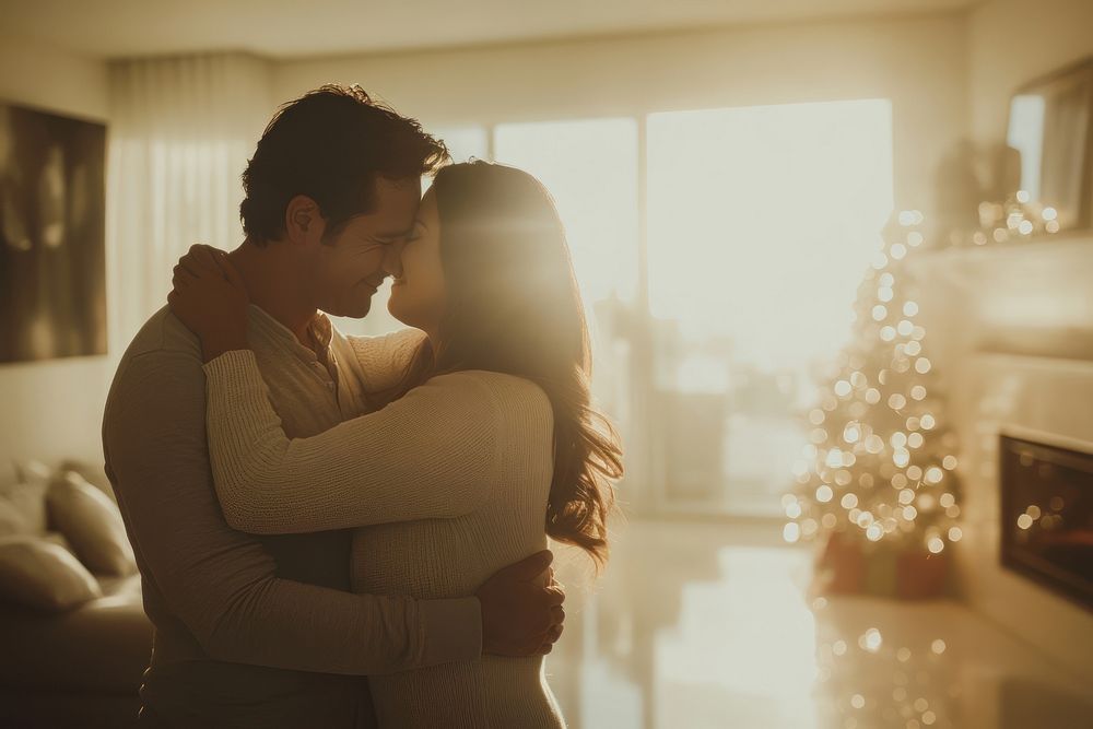 Hispanic couple hugging in the living room with joy romantic holiday home.