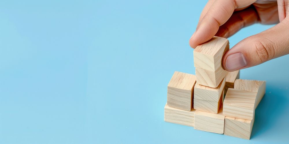 Building blocks hand stacking concept