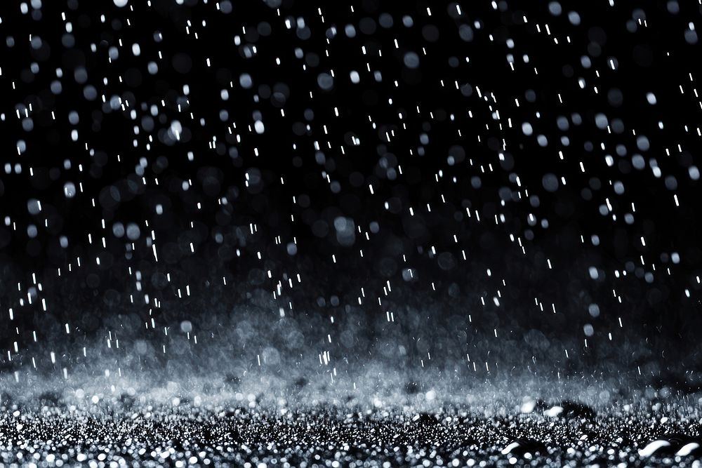 White rain falling background night water.