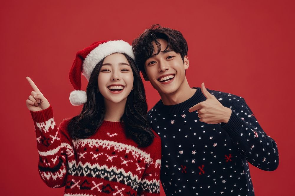 Young Asian couple wearing Christmas sweaters background christmas happy.