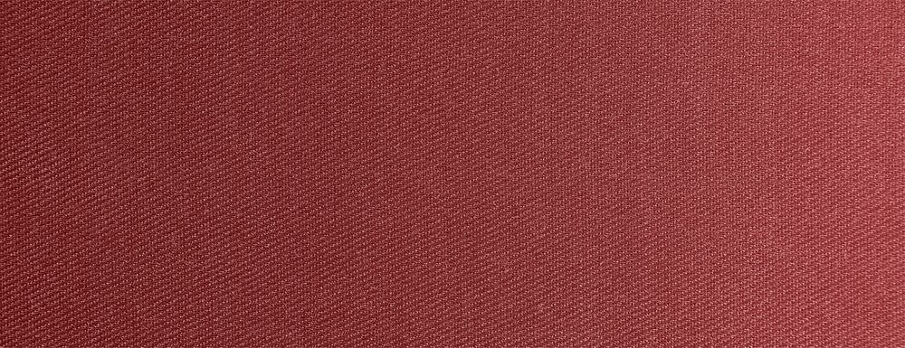 Textured fabric background with a diagonal pattern. The background is a rich, warm brown color, creating a cozy brown…