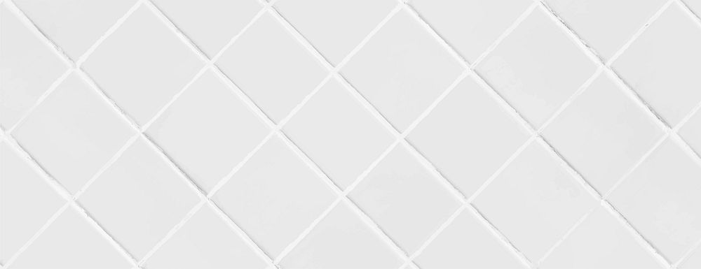 White background with a tiled pattern. The background features a white, glossy texture with diamond-shaped tiles. Clean and…