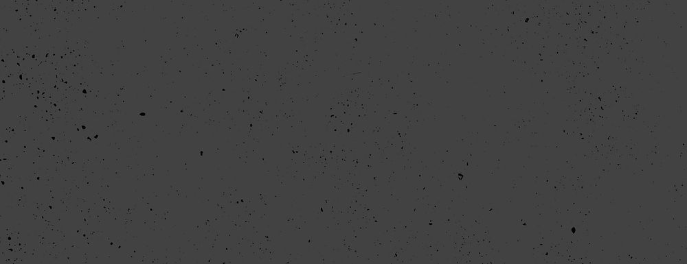 Dark gray background with a speckled texture. The background is gray with scattered black specks, creating a rough, gritty…