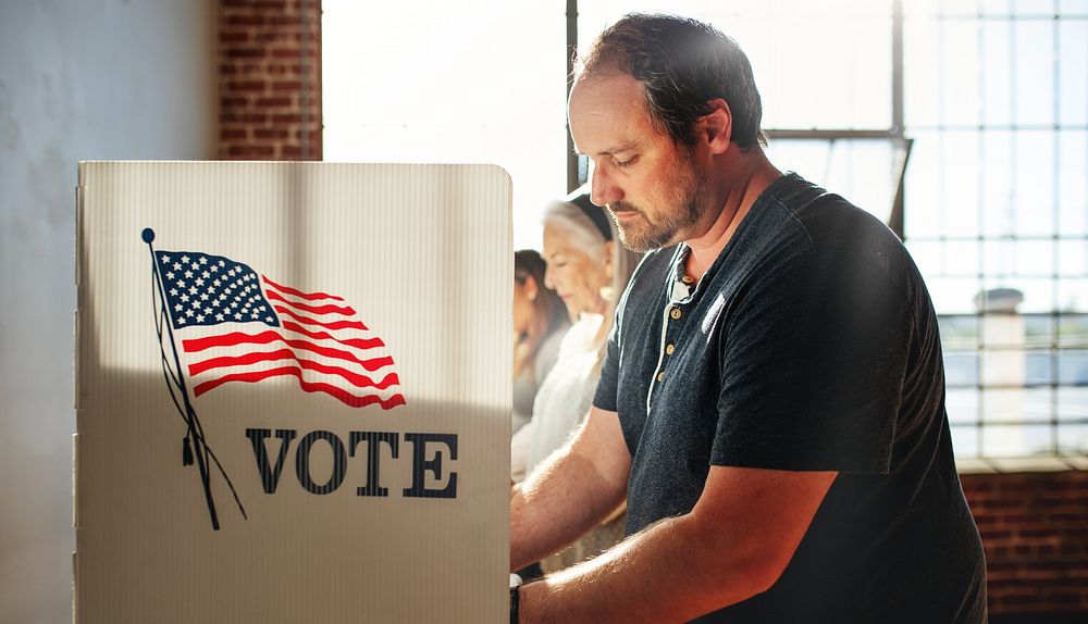 US election day, Diverse American people at voting booth at US election station. Us election day. US election day. People…