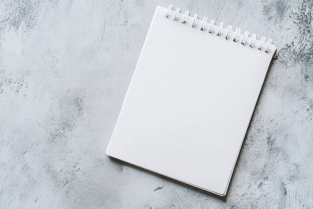 A single white notepad background page notebook.