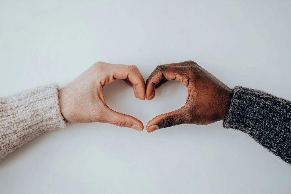 Hands forming the shape of a heart symbol love togetherness.