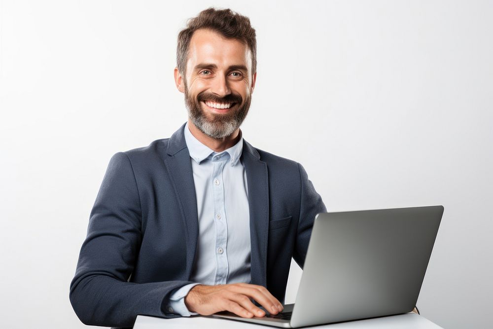 Smiling man with a laptop professional electronics environment.