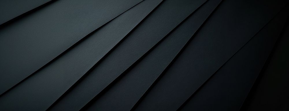 Black paper texture with folding marks background geometric aesthetic.