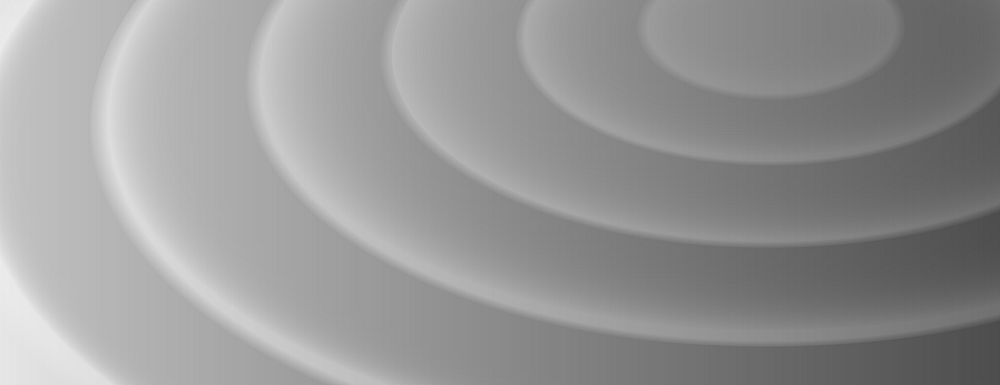 Gray background with concentric circles. The background has a smooth, layered texture. Gray color creates a calm, modern…