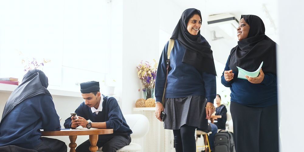 Group of Muslim students in a Muslim school uniforms, wearing traditional attire. Muslim girl students in hijabs in school.…