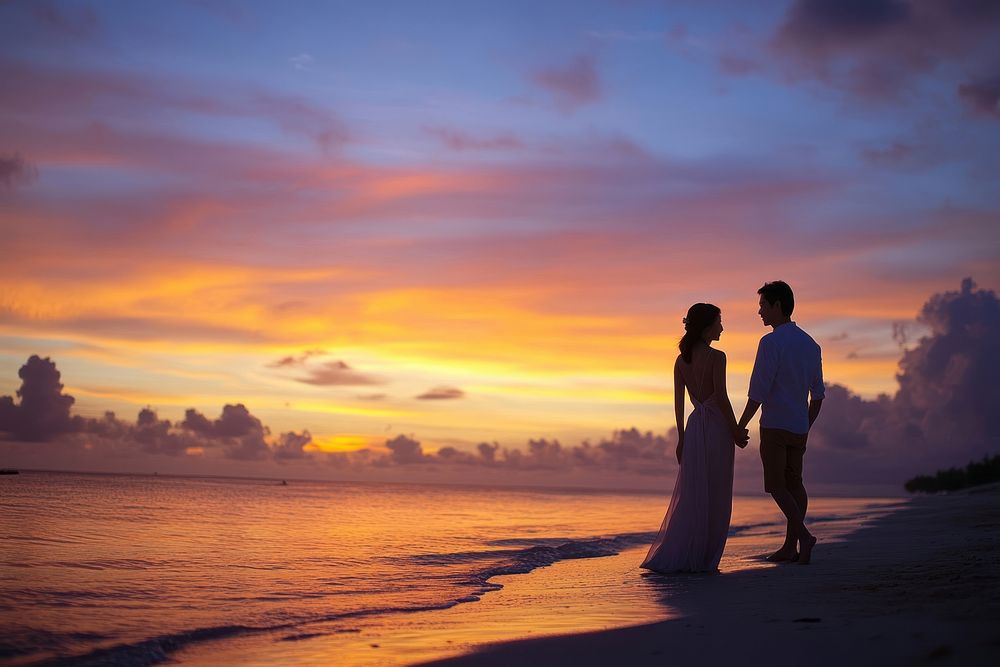 Couple waking photography sunset beach.