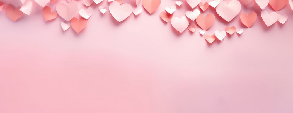 Pink background with heart-shaped valentine romantic hearts.