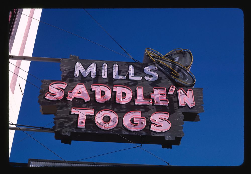 Mills Saddle N' Togs sign, Ellensburg, Washington (1987) photography in high resolution by John Margolies. Original from the…