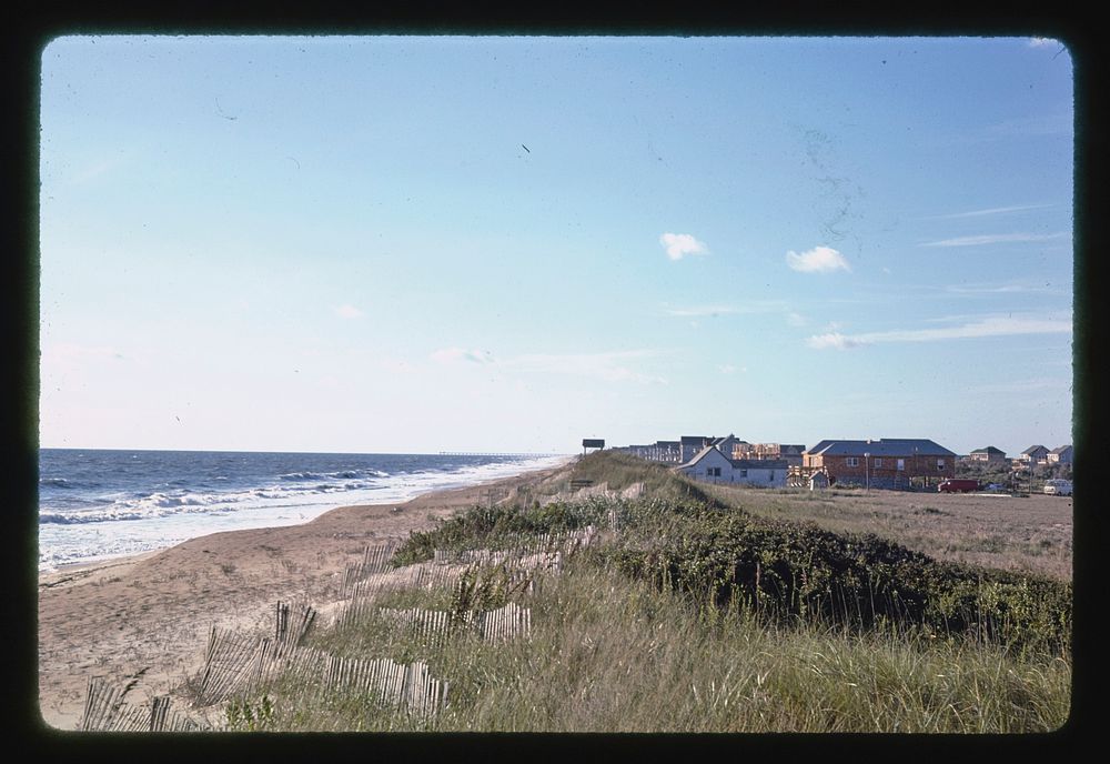 View of beach from the Sanderling Inn, Duck, North Carolina (1985) photography in high resolution by John Margolies.…