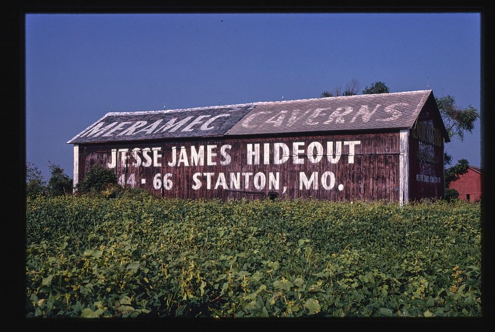 Barn billboard, for Jesse James Hideout in Missouri, Clyde, Ohio (1980) photography in high resolution by John Margolies.…