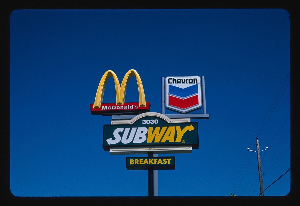 Triple sign (McDonalds, Subway and Chevron gasoline), Meridian, Idaho (2004) photography in high resolution by John…