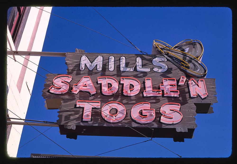 Mills Saddle N' Togs sign, 4th & Main Street, Ellensburg, Washington (1987) photography in high resolution by John…