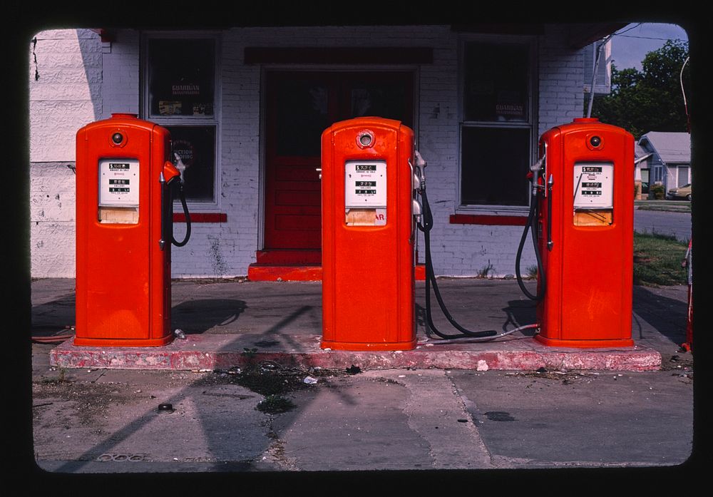 Three red gas pumps, S. Flores, San Antonio, Texas (1982) photography in high resolution by John Margolies. Original from…
