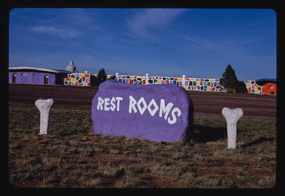 Rest room signs, Flintstone's Bedrock City, Valle, Arizona (1987) photography in high resolution by John Margolies. Original…