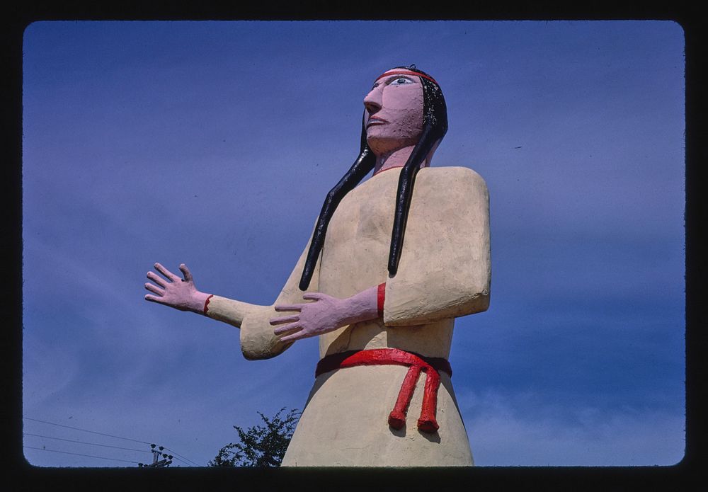 Pocahontas statue detail 2, souvenir stand, Route 3, Pocahontas, Iowa (1987) photography in high resolution by John…