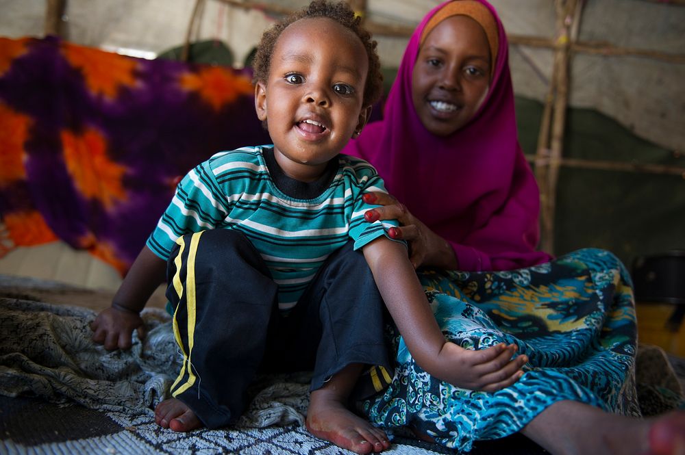 Two year old Nasri stares at the camera. Nasri was born to Ifrah Abdulle soon after her mother got married. Ifrah has sworn…