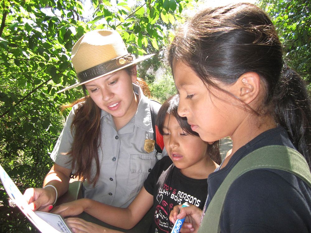 Ranger with Children. A park ranger helps youngsters identify native plants at Solstice Canyon in Malibu. Original public…
