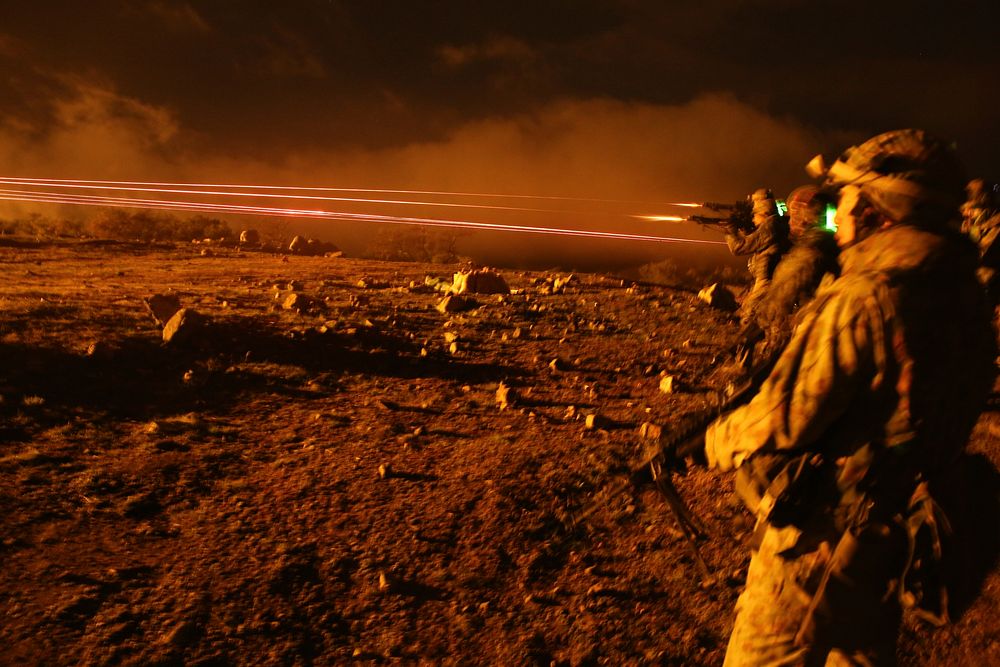 Japan Ground Self-Defense Force soldiers fire Minimi light machine guns while training with U.S. Marines assigned to the 1st…