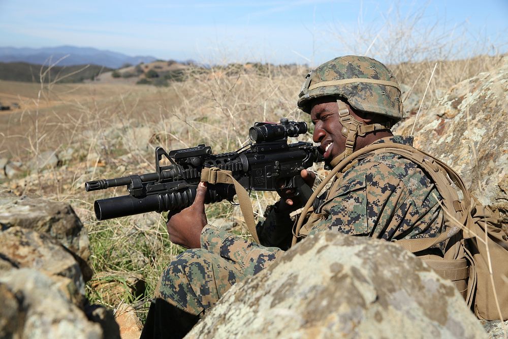 A U.S. Marine with the 1st Battalion, 1st Marine Regiment trains with Japan Ground Self-Defense Force soldiers at Marine…
