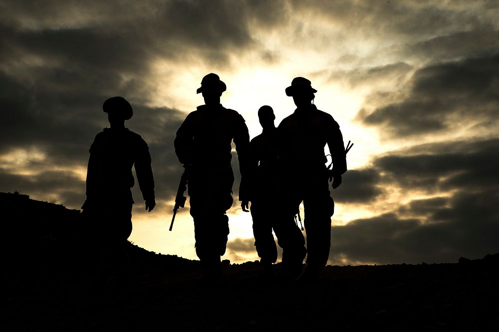 U.S. Marines with Alpha Company, 1st Battalion, 4th Marine Regiment, 13th Marine Expeditionary Unit (MEU) walk after…