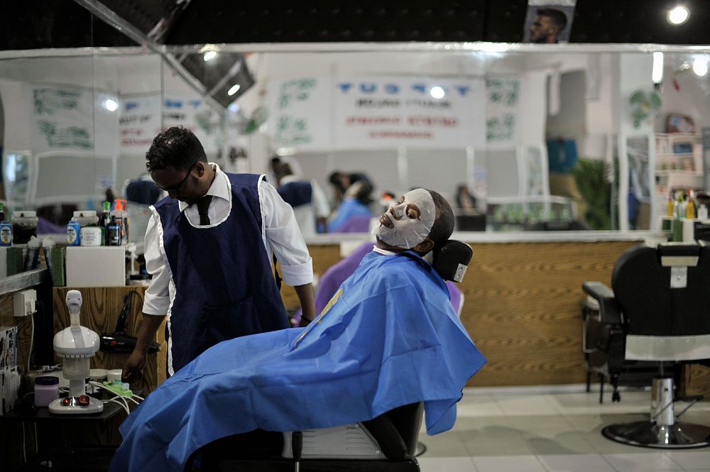 A hairdresser gives a client a facial at Abdulqadir Abdul's newly opened barber shop in Mogadishu, Somalia, on January 20.…