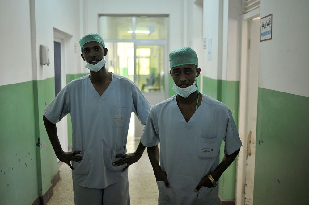 Two surgeons stand in the hallway of Banadir hospital in Mogadishu, Somalia, on February 4. AU UN IST PHOTO / Tobin Jones.…
