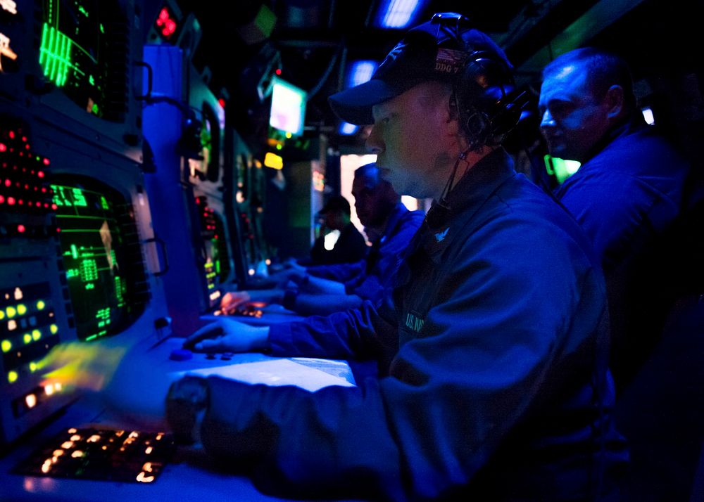 U.S. Sailors monitor a sonar console for contacts aboard the guided missile destroyer USS Donald Cook (DDG 75) in the…