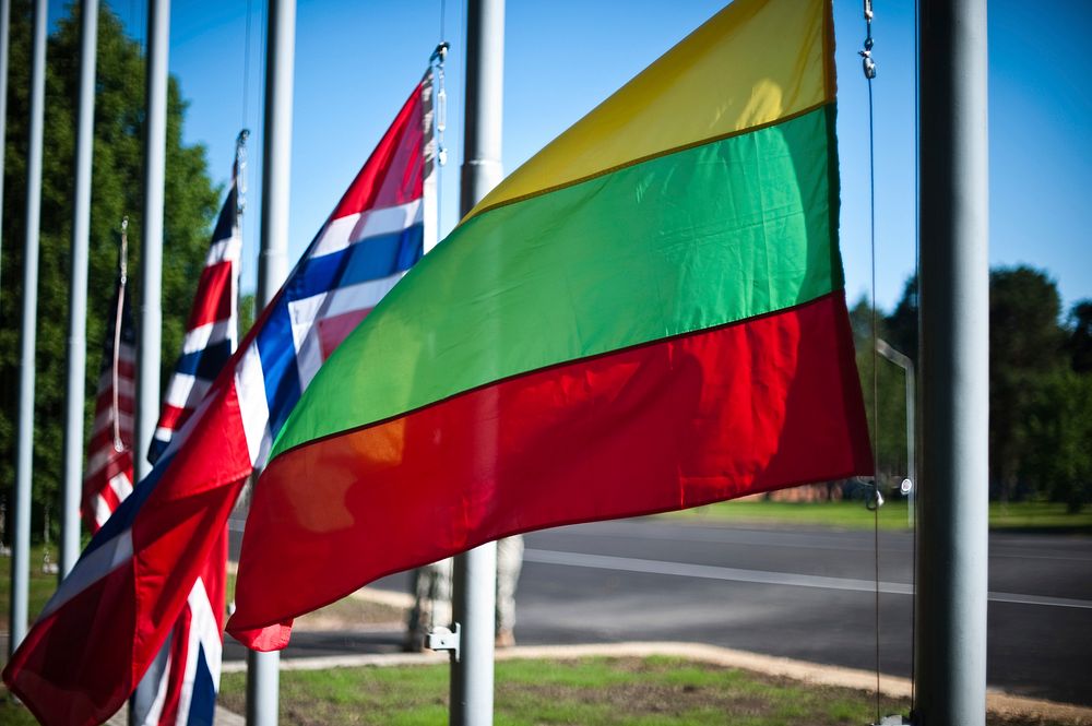 Adazi Training Area, LATVIA &ndash; The Lithuanian flag is seen flying before the Saber Strike 2014 opening ceremony here…