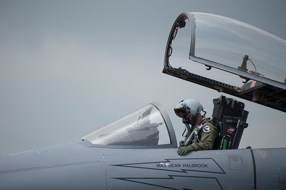 U.S. Air Force Maj. Sean Halbrook, an F-15 Eagle aircraft pilot with the 131st Fighter Squadron, 104th Fighter Wing…