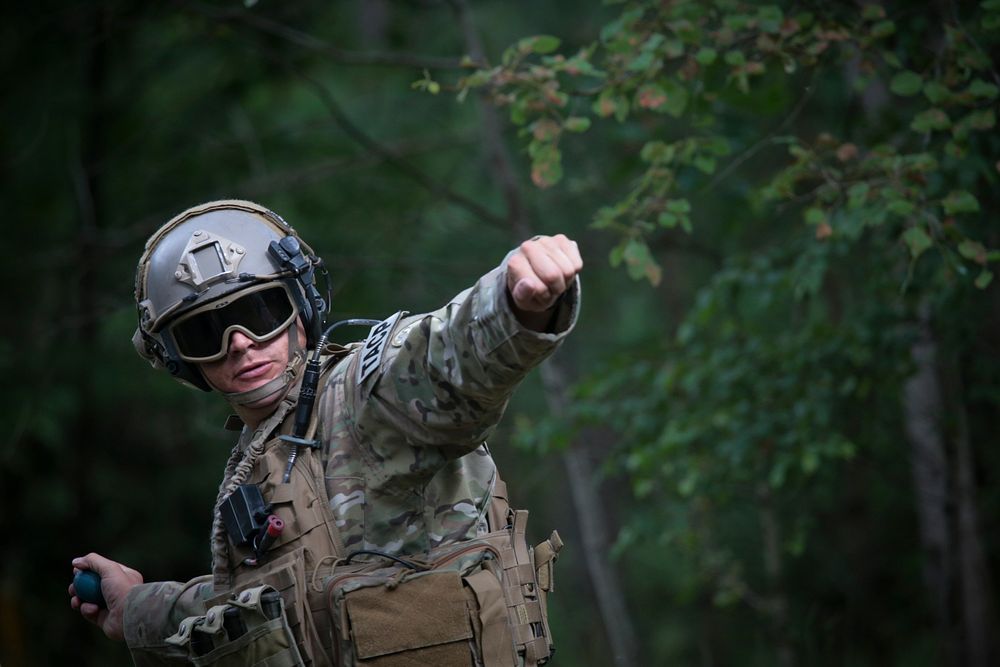 A U.S. Air Force tactical air control party Airman from the 124th Fighter Wing throws a practice grenade during Operation…