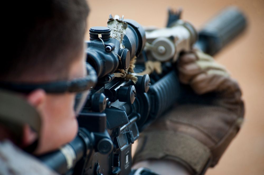 U.S. Marine Corps Lance Cpl. John Wachman with Echo Company 4th Reconnaissance Battalion battle sight zeroes his weapon…