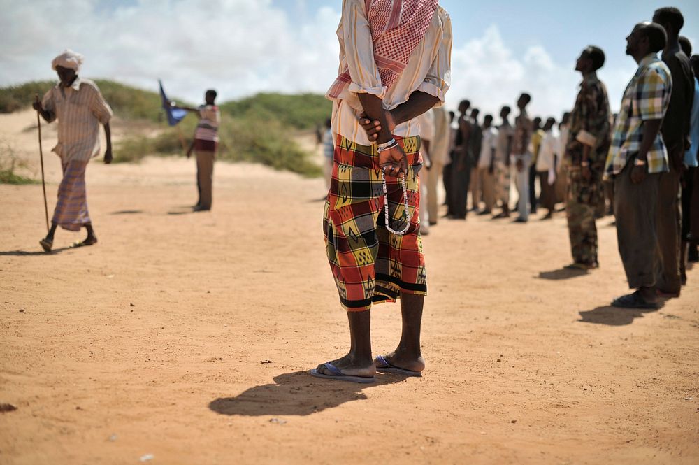 A Somali elder stands with his prayer beads during a demonstration by a local militia, formed in order to provide security…