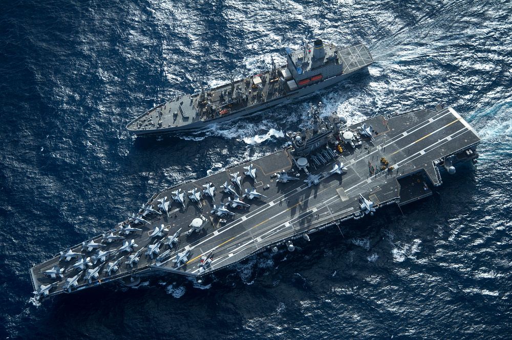 The aircraft carrier USS Carl Vinson (CVN 70) and the fleet replenishment oiler USNS Yukon (T-AO 202) conduct a…