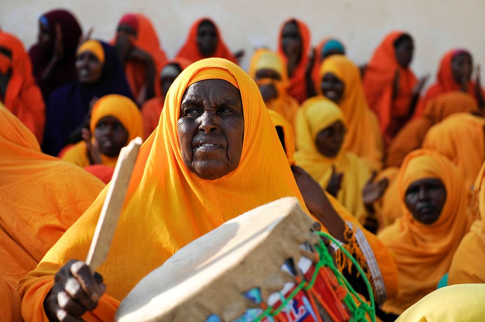 An elderly Woman drums during a game between Halane and G. Da'ud football clubs at Wadajir Stadium in Mogadishu, Somalia on…