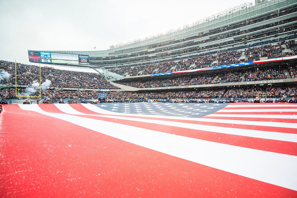 American flag in football stadium. Original public domain image from Flickr