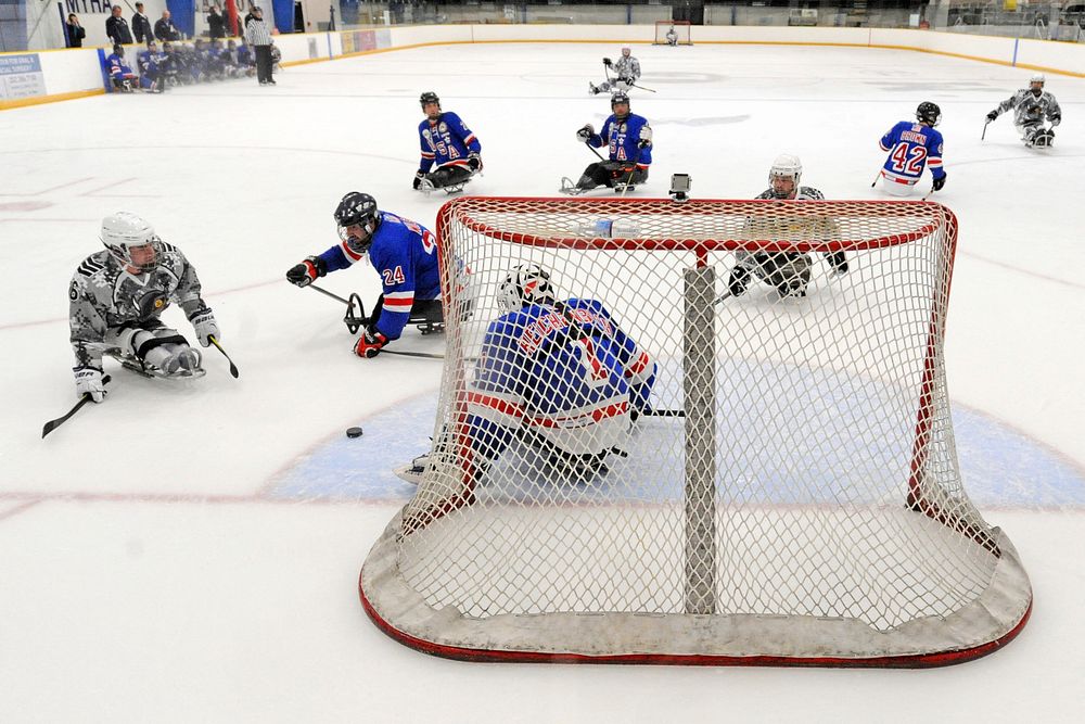 The San Antonio Rampage puts offensive pressure on the USA Warriors sled hockey team during a game in Rockville, Md. Sept.…