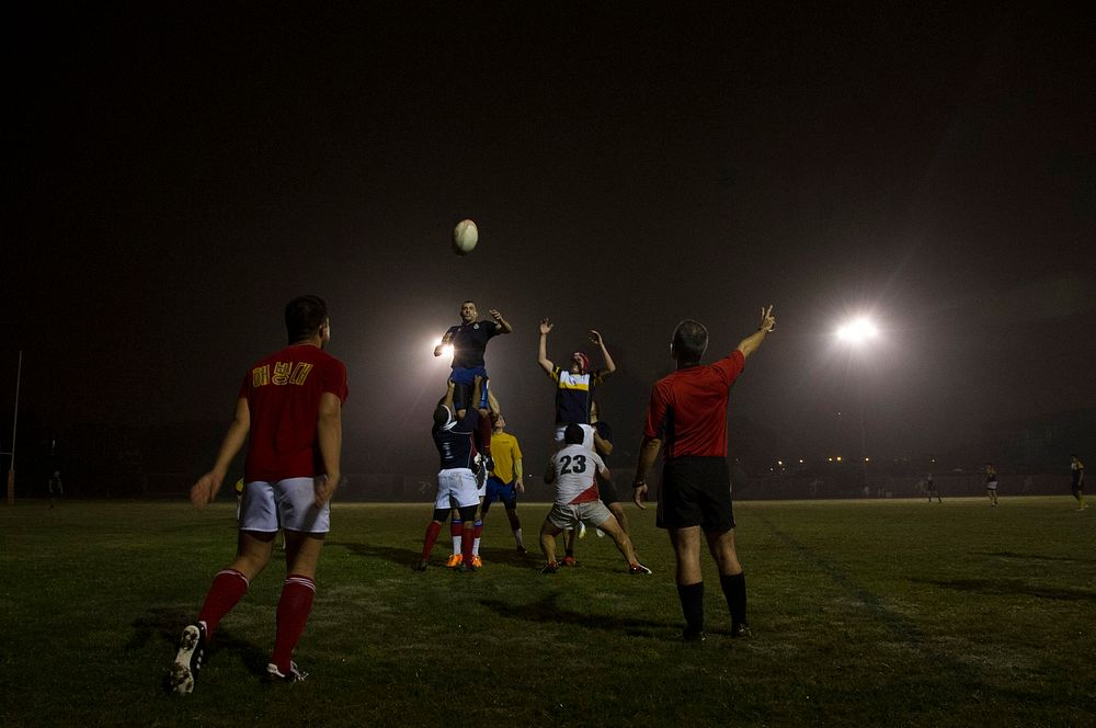 U.S. Sailors and Marines assigned to the amphibious assault ship USS America (LHA 6) and Peruvian sailors play rugby in…