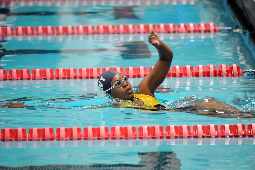 Navy team&rsquo;s Petty Officer 2nd Class Sharona Young begins the women&rsquo;s 50 meter freestyle event of the 2014…